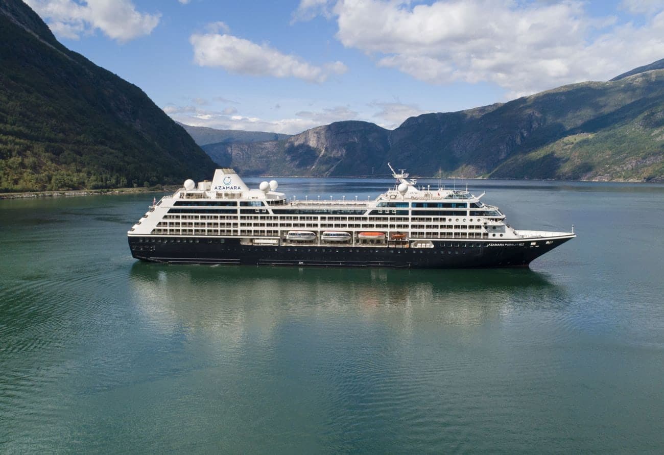Azamara cruise ship sailing through a Norwegian fjord