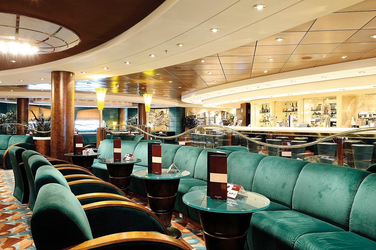 MSC Orchestra Amber Bar lounge with emerald seating