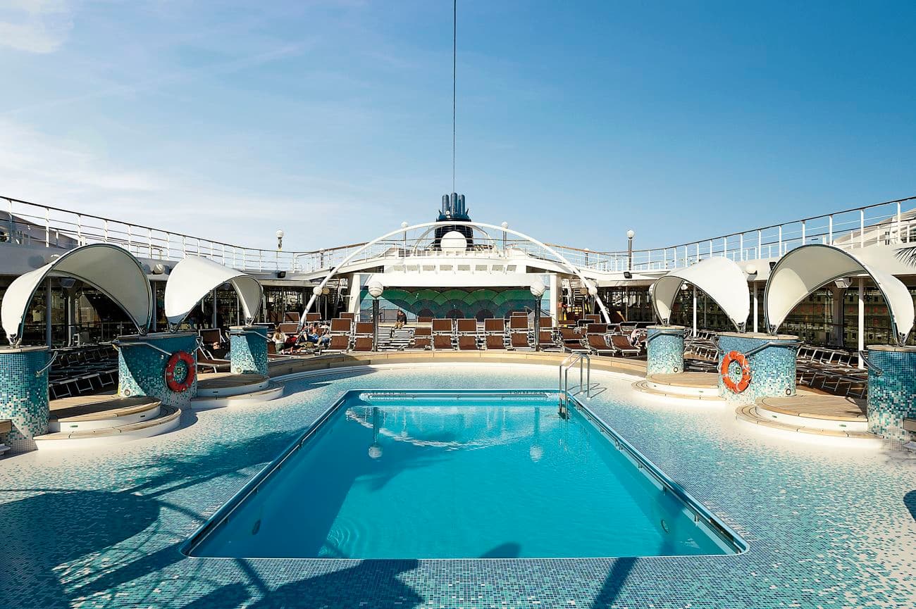 Le Piscine main pool area with sun loungers and turquoise water