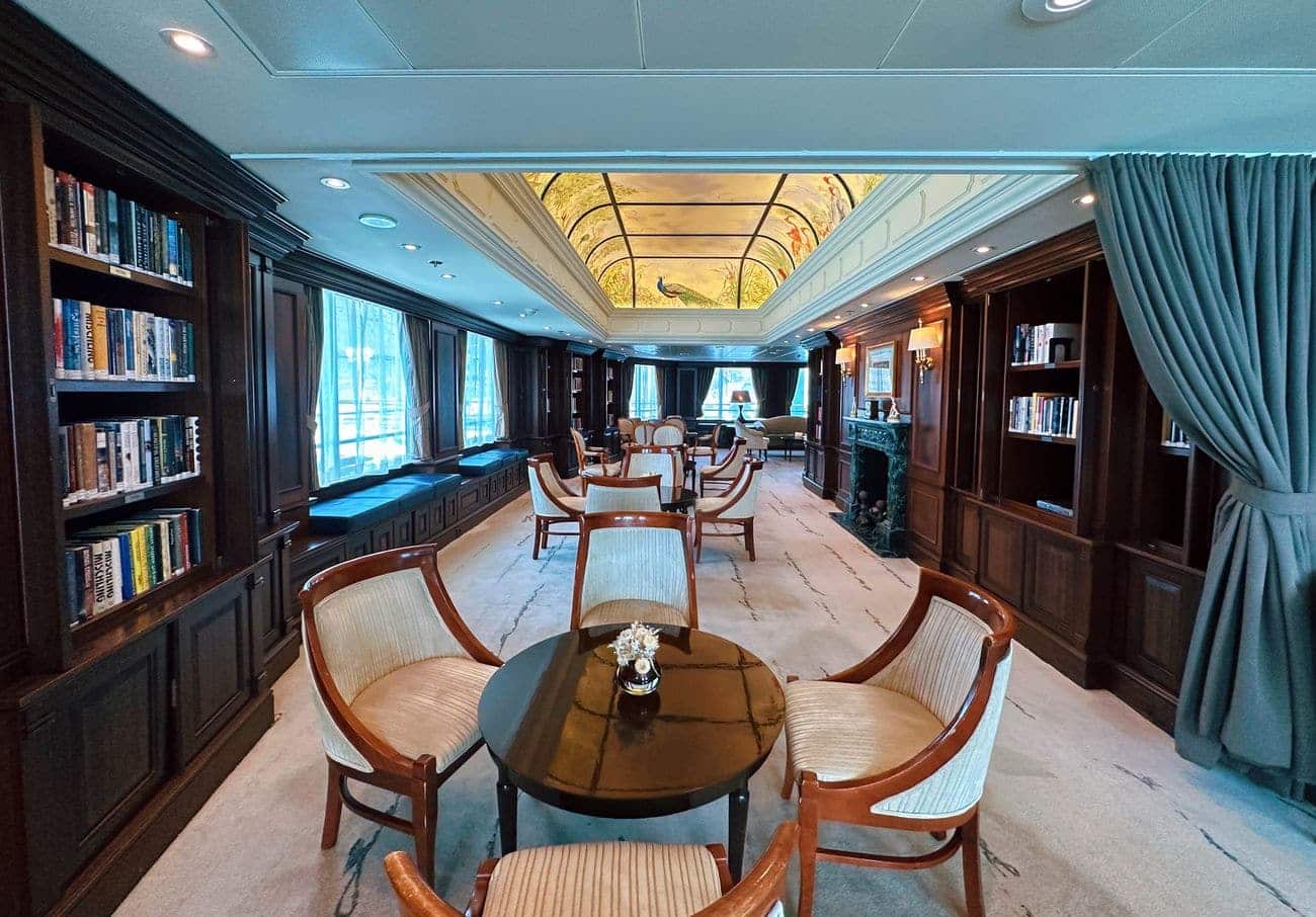 The Drawing Room library with bookshelves and seating