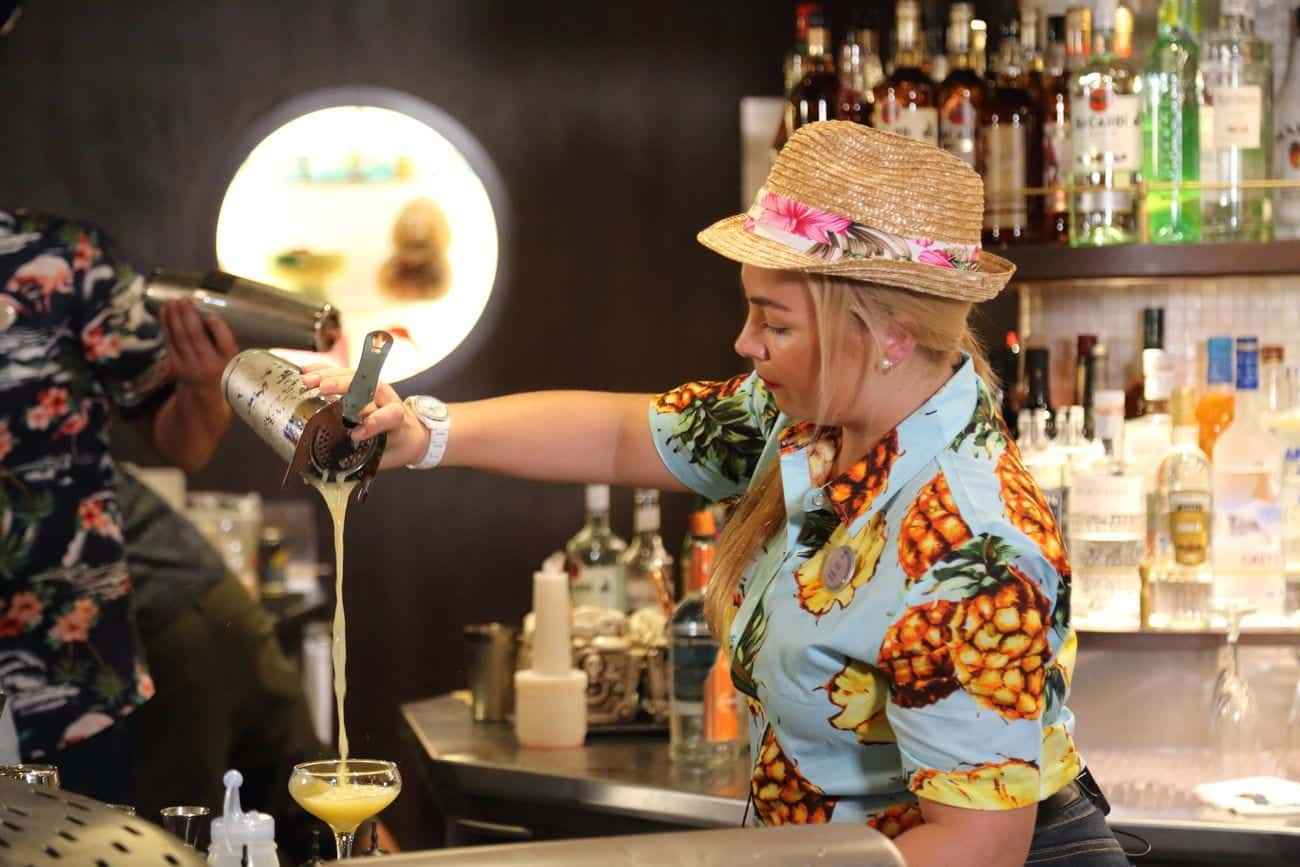 Bartender pouring cocktail at the Bamboo Room on Mariner of the Seas