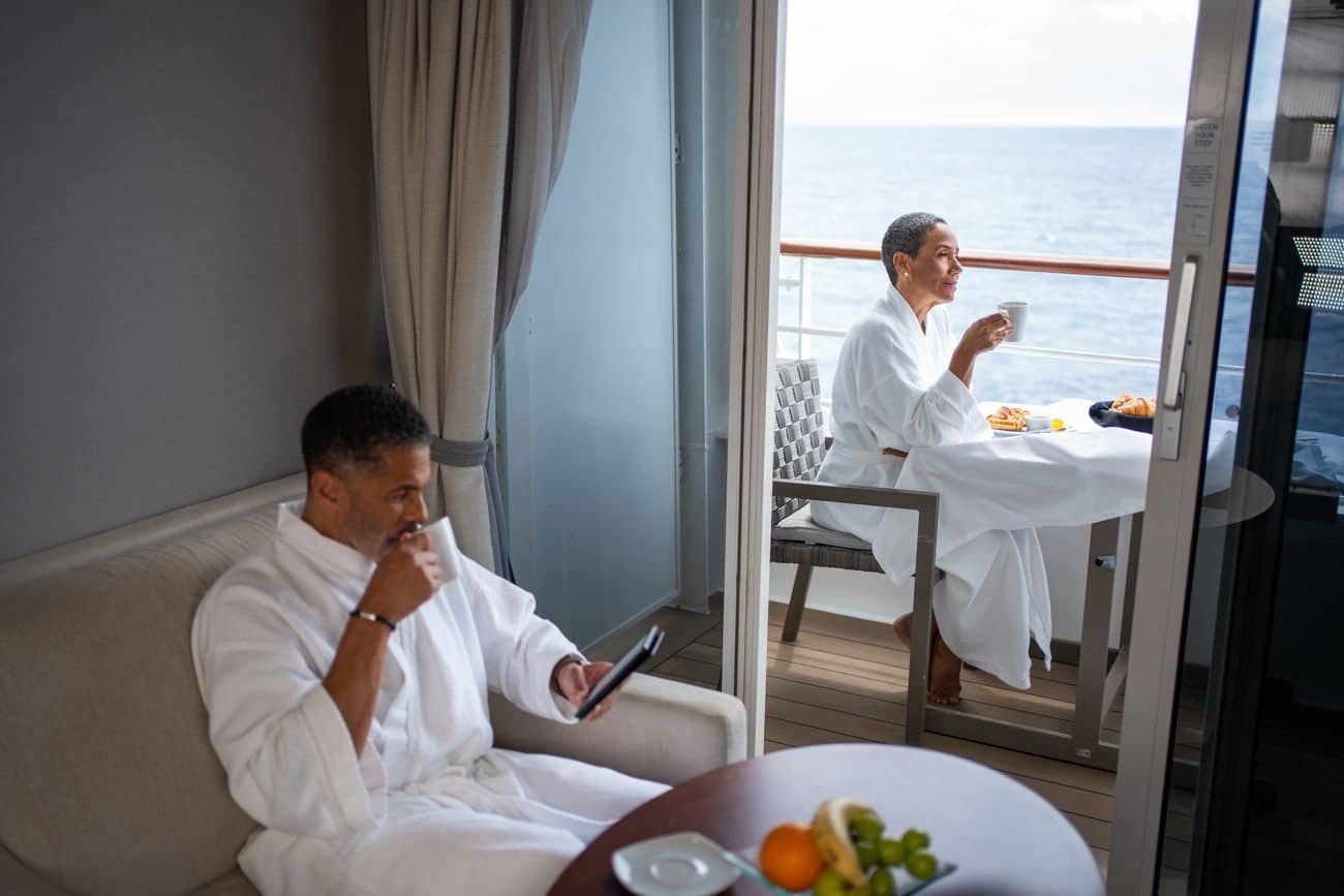 Guests enjoying breakfast inside a veranda stateroom