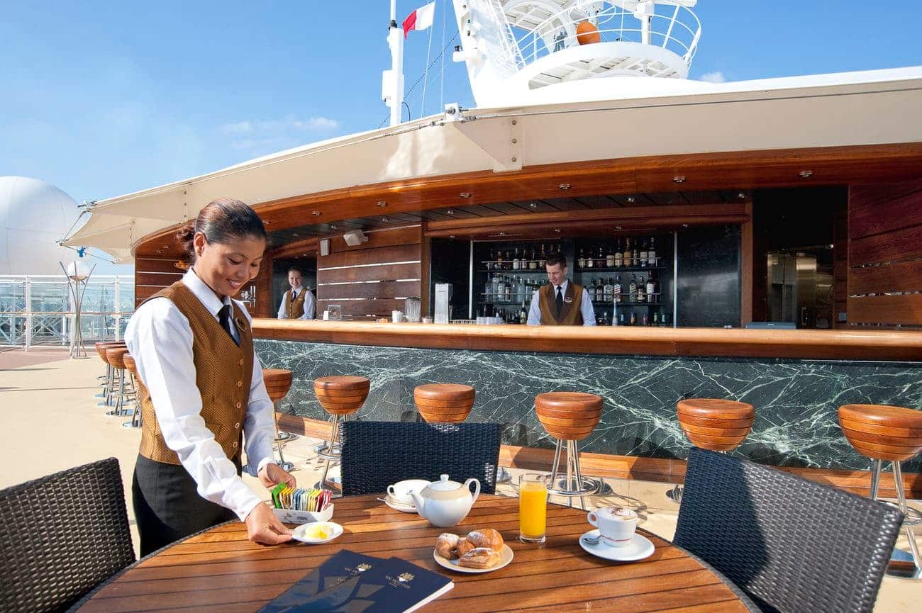 MSC Cruises Yacht Club service on a sunny open deck