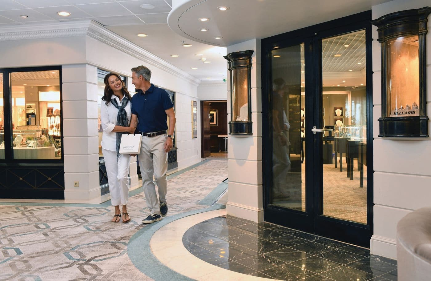 Couple walking past Riviera’s boutique shops