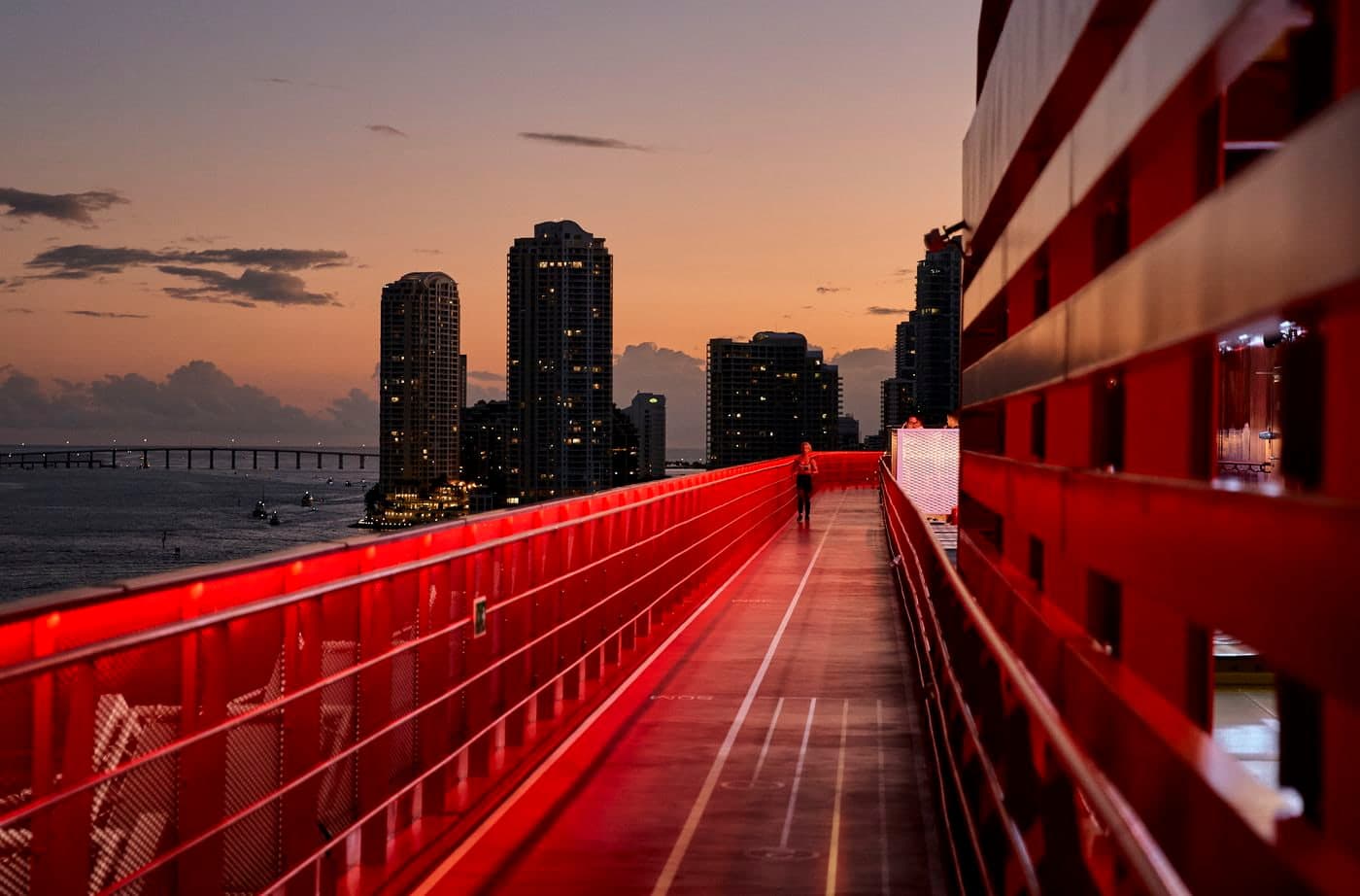 Virgin Voyages Resilient Lady running track at sunset