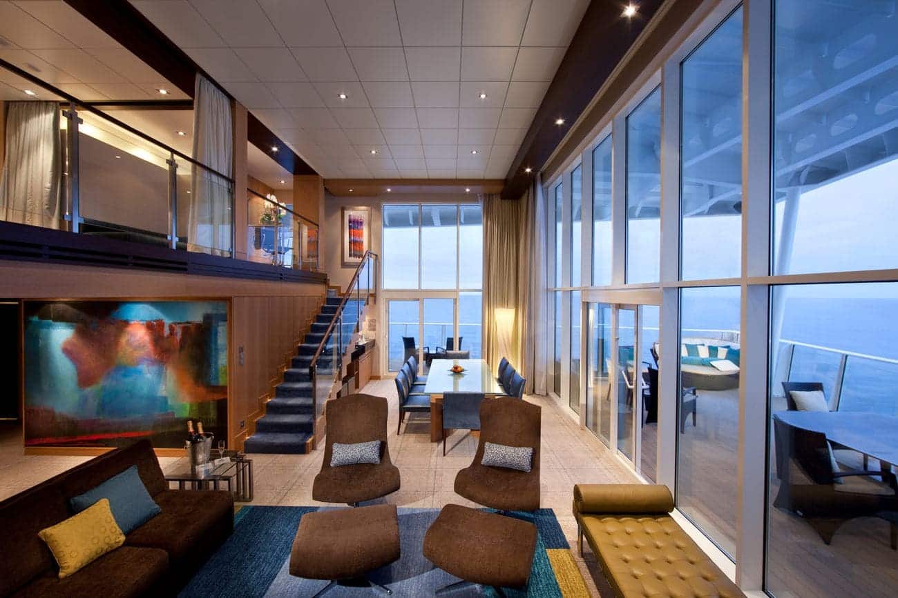 Royal Loft Suite on Allure of the Seas featuring two levels and floor-to-ceiling windows