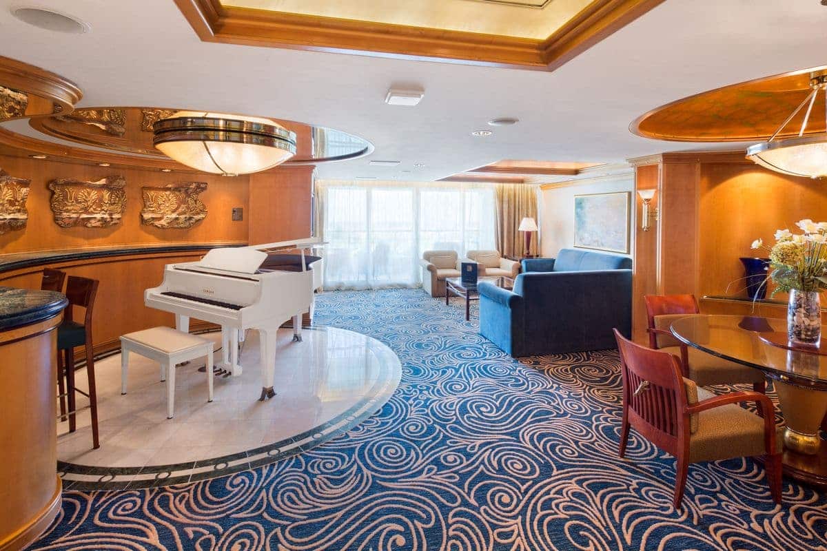Royal Suite featuring a white grand piano and elegant furnishings
