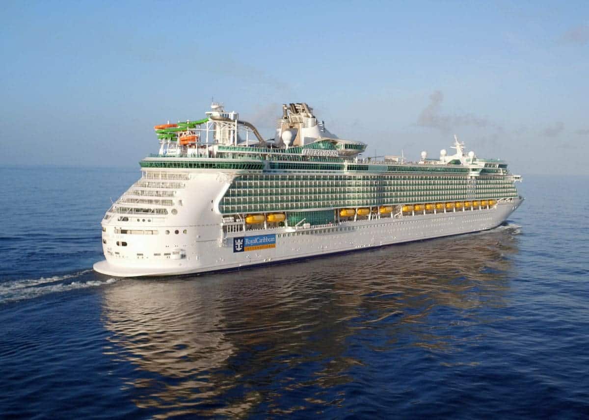Liberty of the Seas cruising on a calm blue sea under clear skies