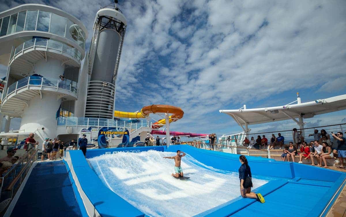 Guest surfing on the FlowRider aboard Navigator of the Seas