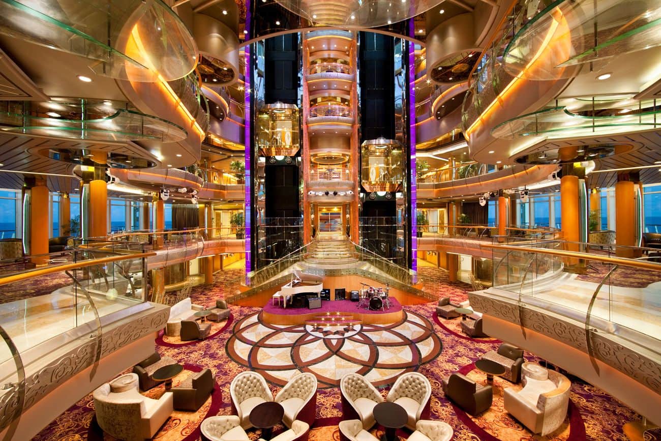 Centrum atrium on Royal Caribbean’s Rhapsody of the Seas with glass elevators and live music area