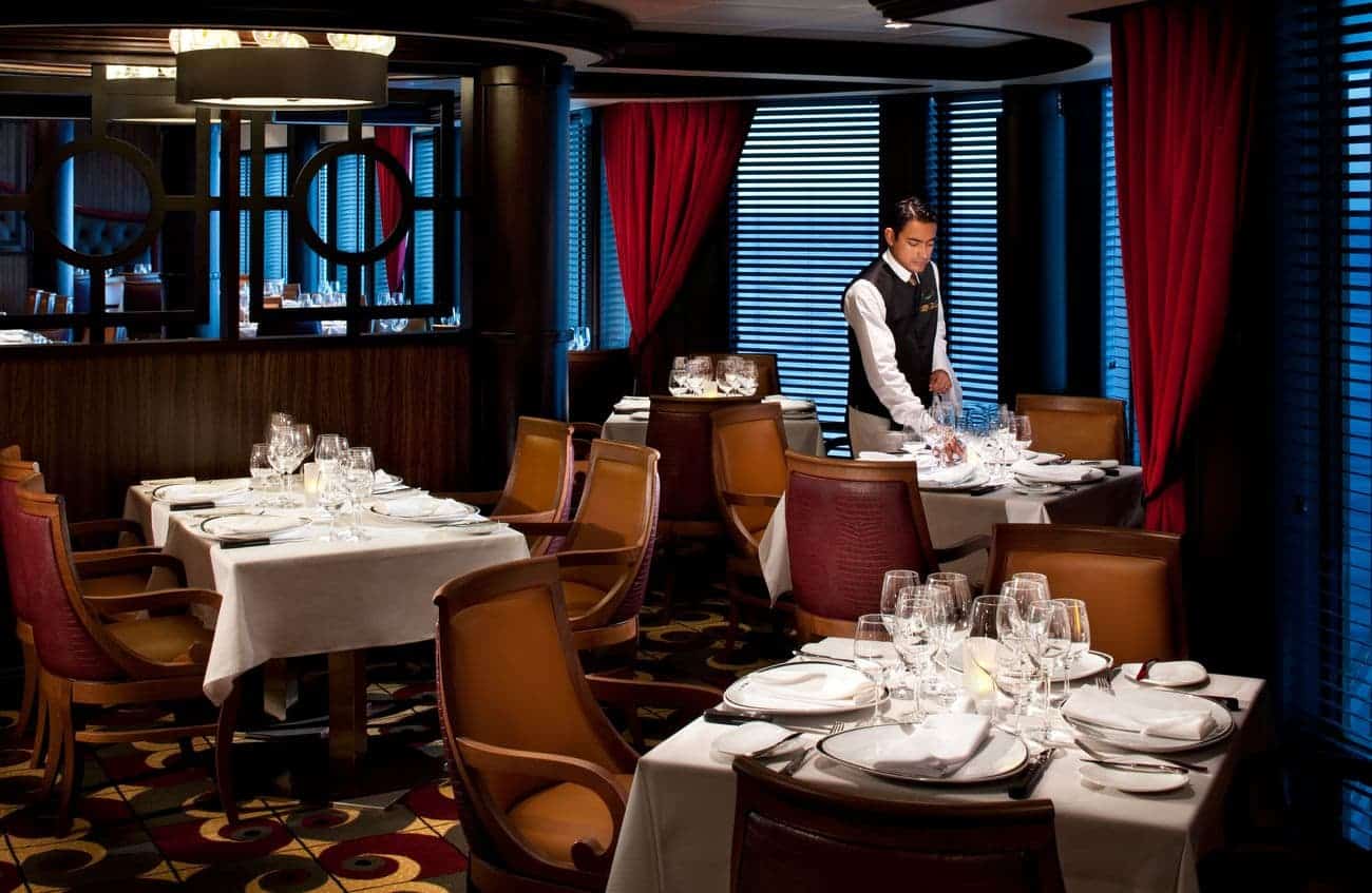 Chops Grille steakhouse on Royal Caribbean’s Rhapsody of the Seas with elegant table settings