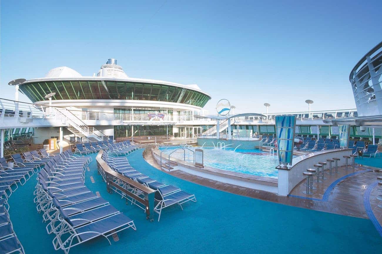 Pool deck on Royal Caribbean’s Serenade of the Seas with sun loungers and ocean views