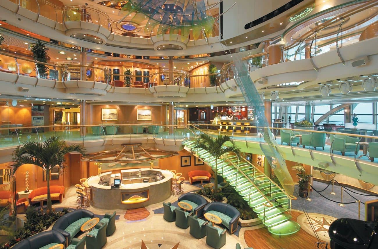 The Centrum atrium on Royal Caribbean’s Serenade of the Seas with glass staircases and open balconies