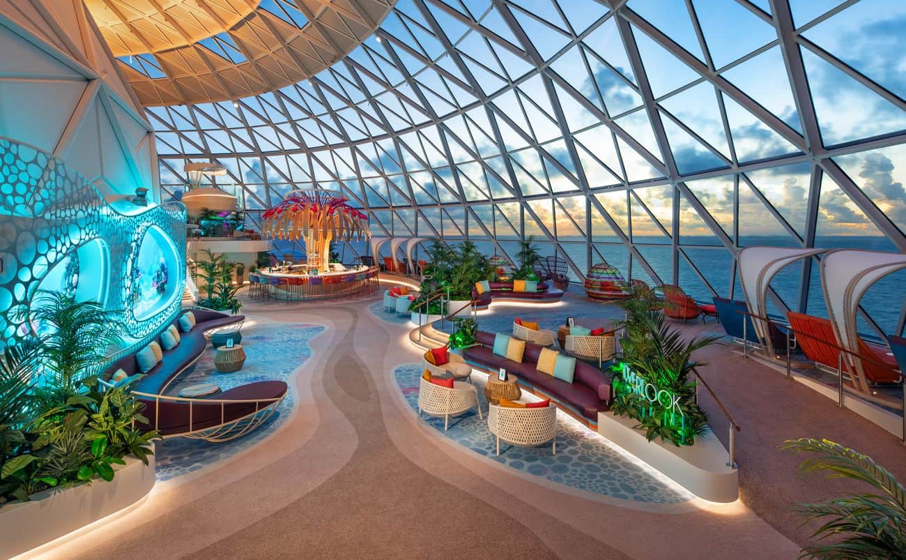 The Overlook Lounge in the AquaDome on Star of the Seas with panoramic glass walls and ocean views
