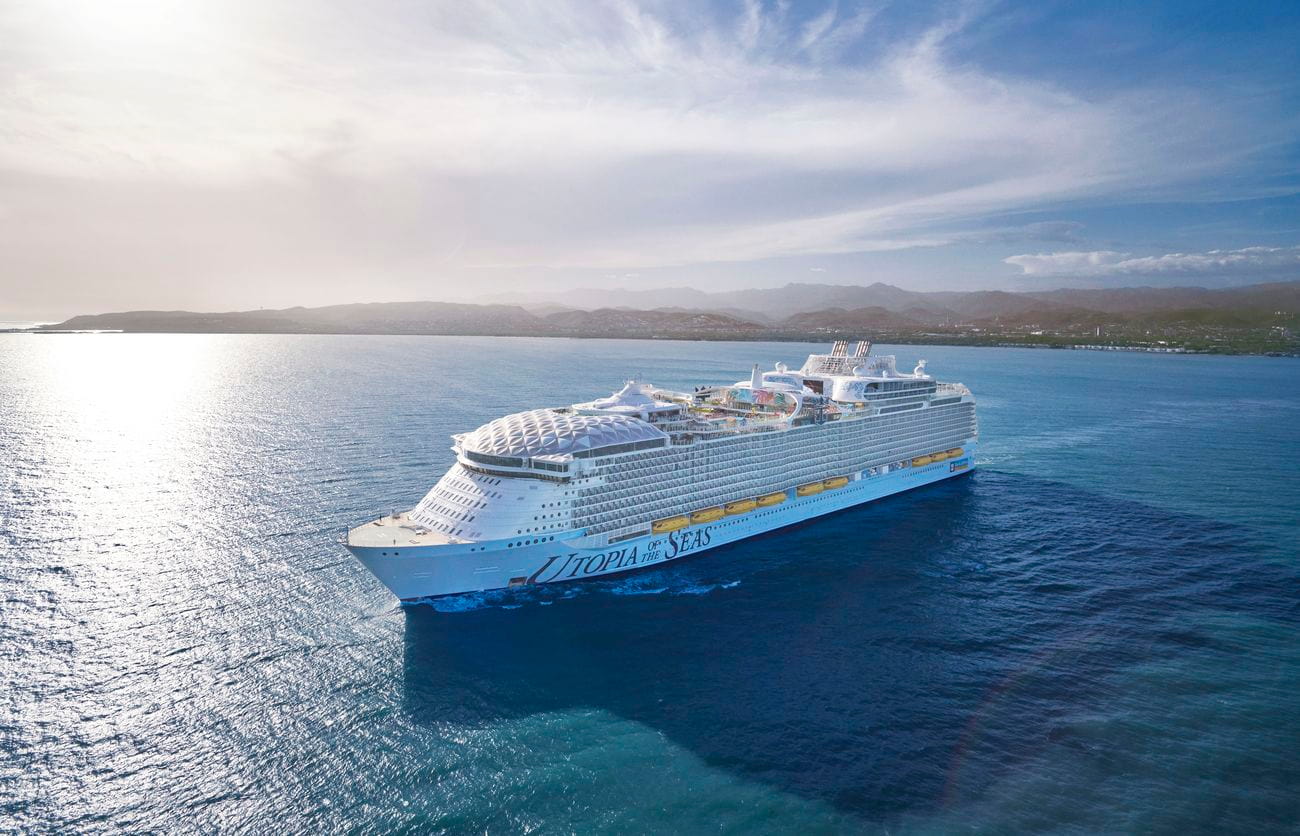 Utopia of the Seas sailing near Port Canaveral with coastline in background