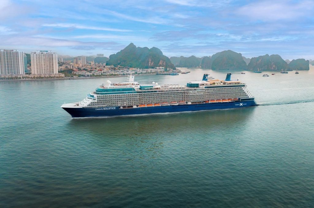 Celebrity Solstice sailing through Ha Long Bay, Vietnam with limestone islands nearby - Celebrity Cruises 2027-2028 itineraries