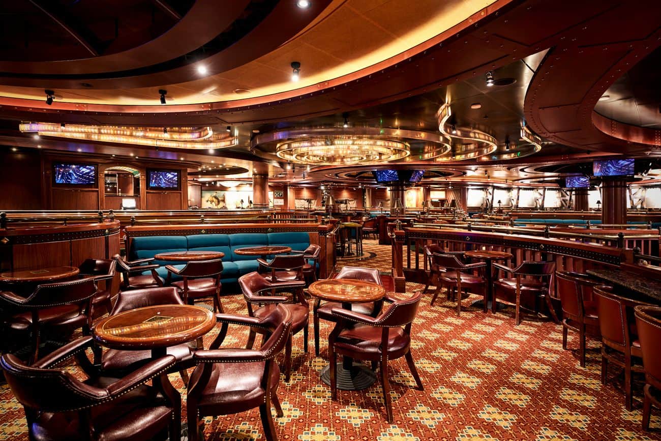 Club Fusion lounge on Diamond Princess with stage lighting and rich wood interiors