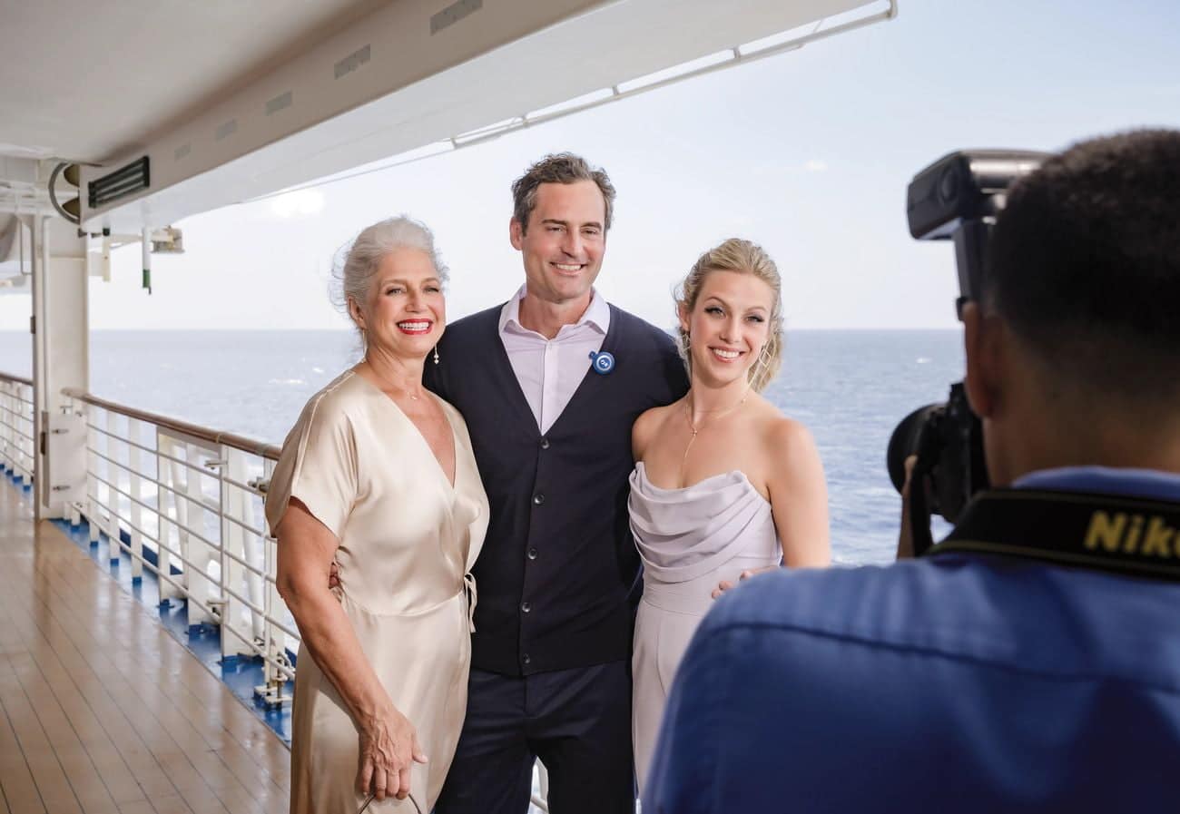 Guests posing for a professional photo on Discovery Princess