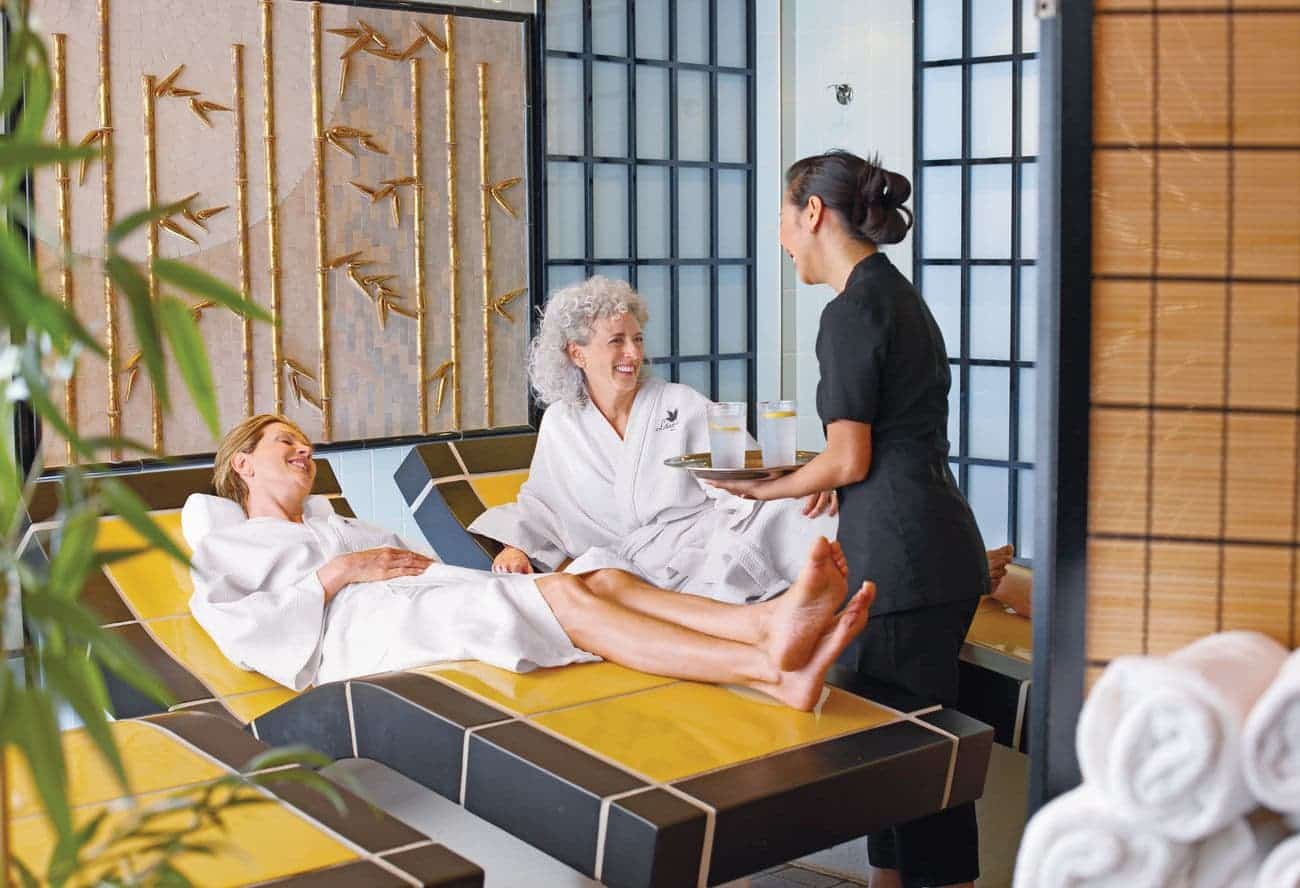 Guests relaxing on thermal beds in the Lotus Spa aboard Emerald Princess