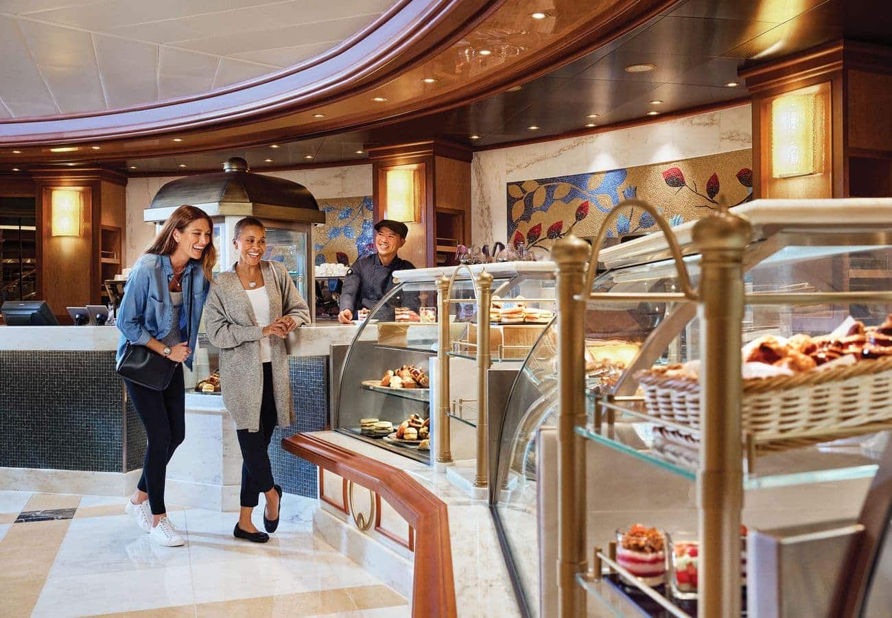Guests selecting pastries and coffee at the International Café