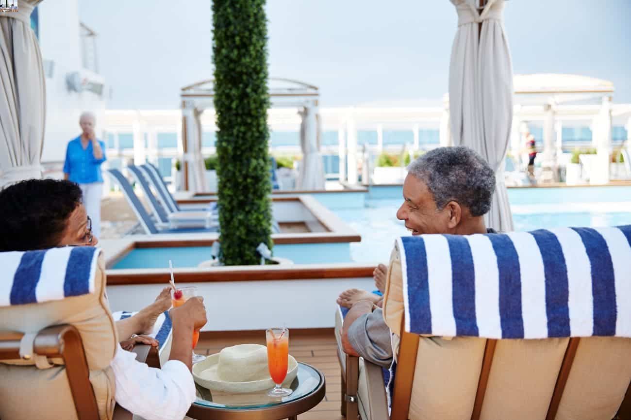 Guests relaxing in cabanas at The Sanctuary on Regal Princess