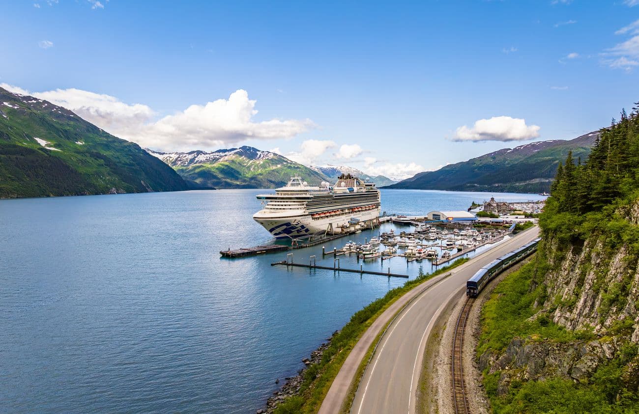 Sapphire Princess docked in Whittier, Alaska with mountains and marina in the background