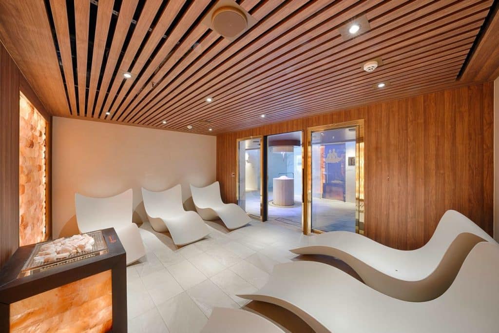 Thermal relaxation lounge inside the MSC Aurea Spa on MSC Magnifica with heated loungers and salt wall