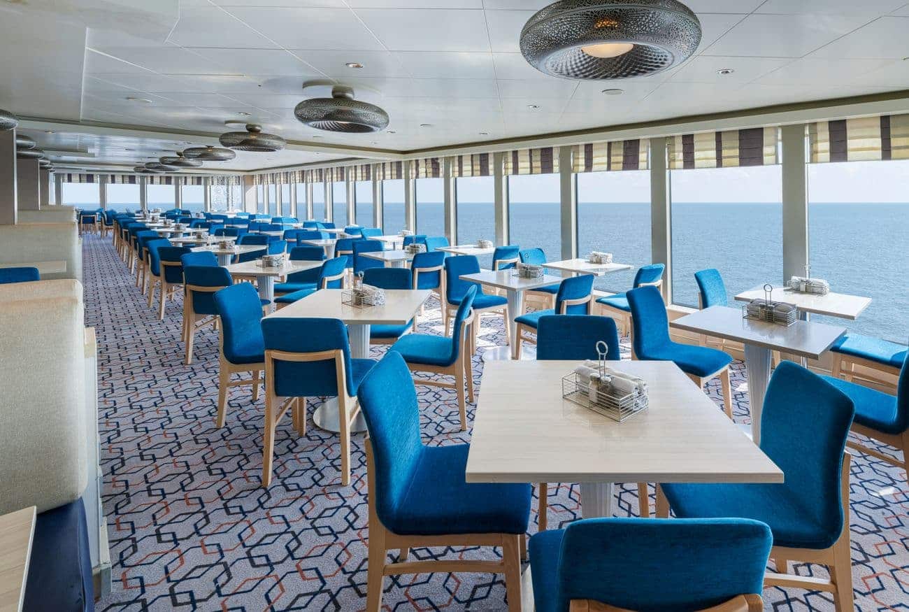 Garden Café on Norwegian Breakaway with ocean views, bright seating, and large panoramic windows