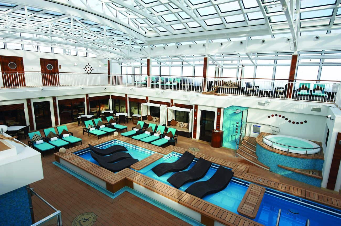 The Haven Courtyard with a private pool, loungers, and glass-roofed atrium
