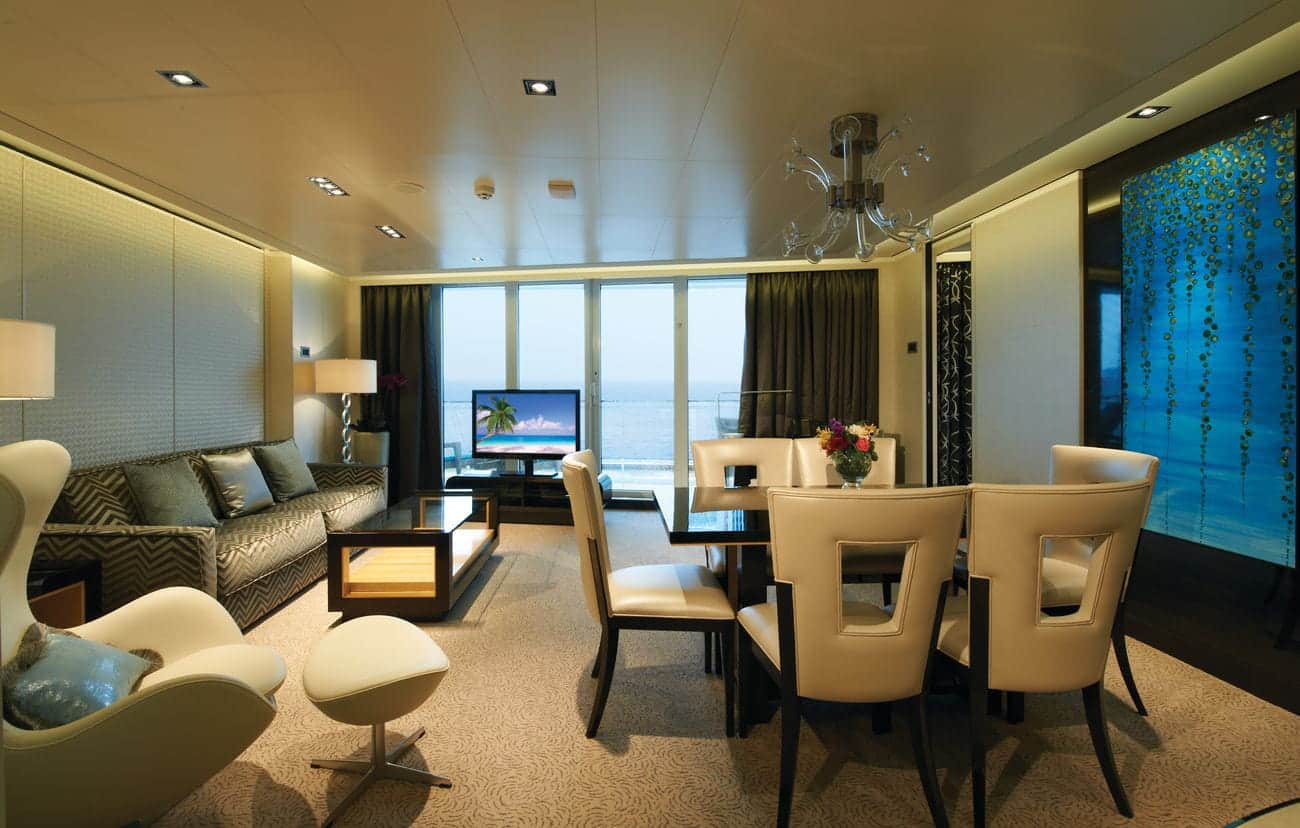 Haven Deluxe Owner’s Suite living and dining area on Norwegian Breakaway with balcony and ocean view