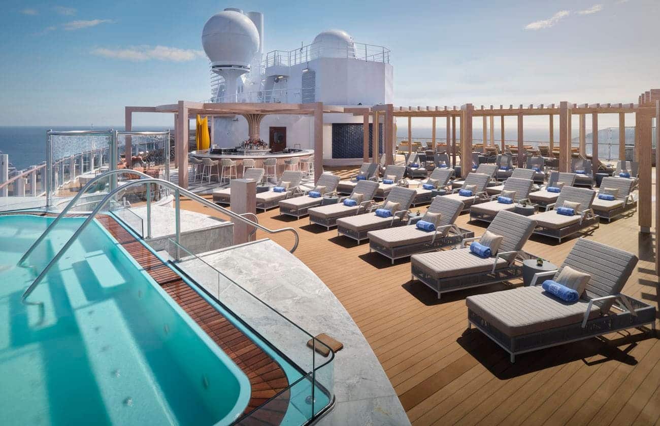 Vibe Beach Club sun deck with loungers and infinity pool