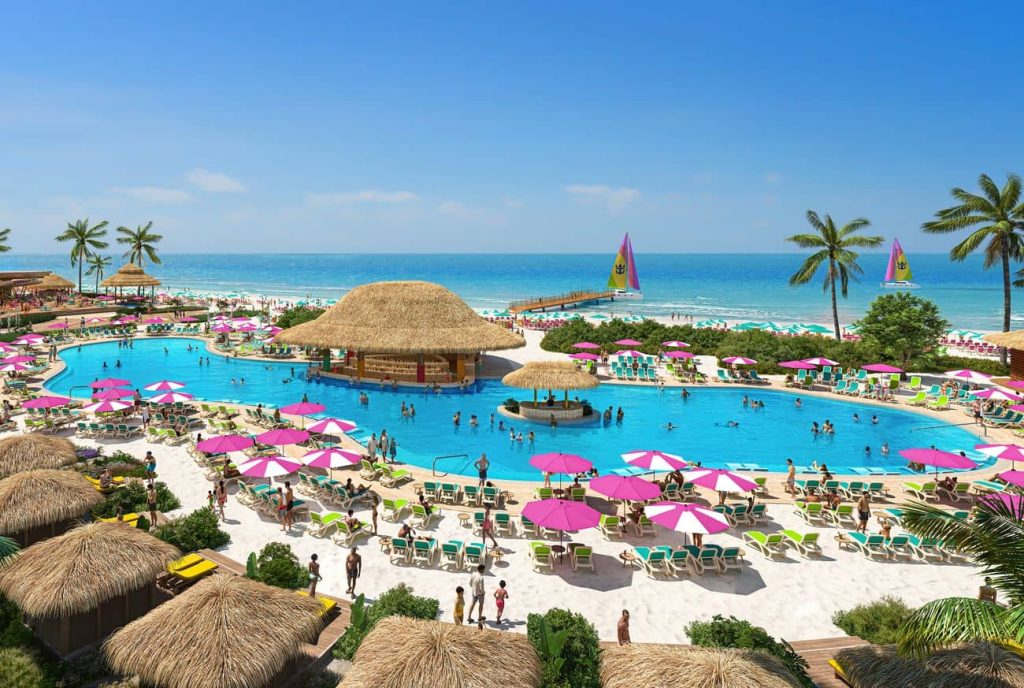 CGI aerial view of the Royal Beach Club Cozumel featuring a large lagoon pool pink and green umbrellas and beachfront cabanas