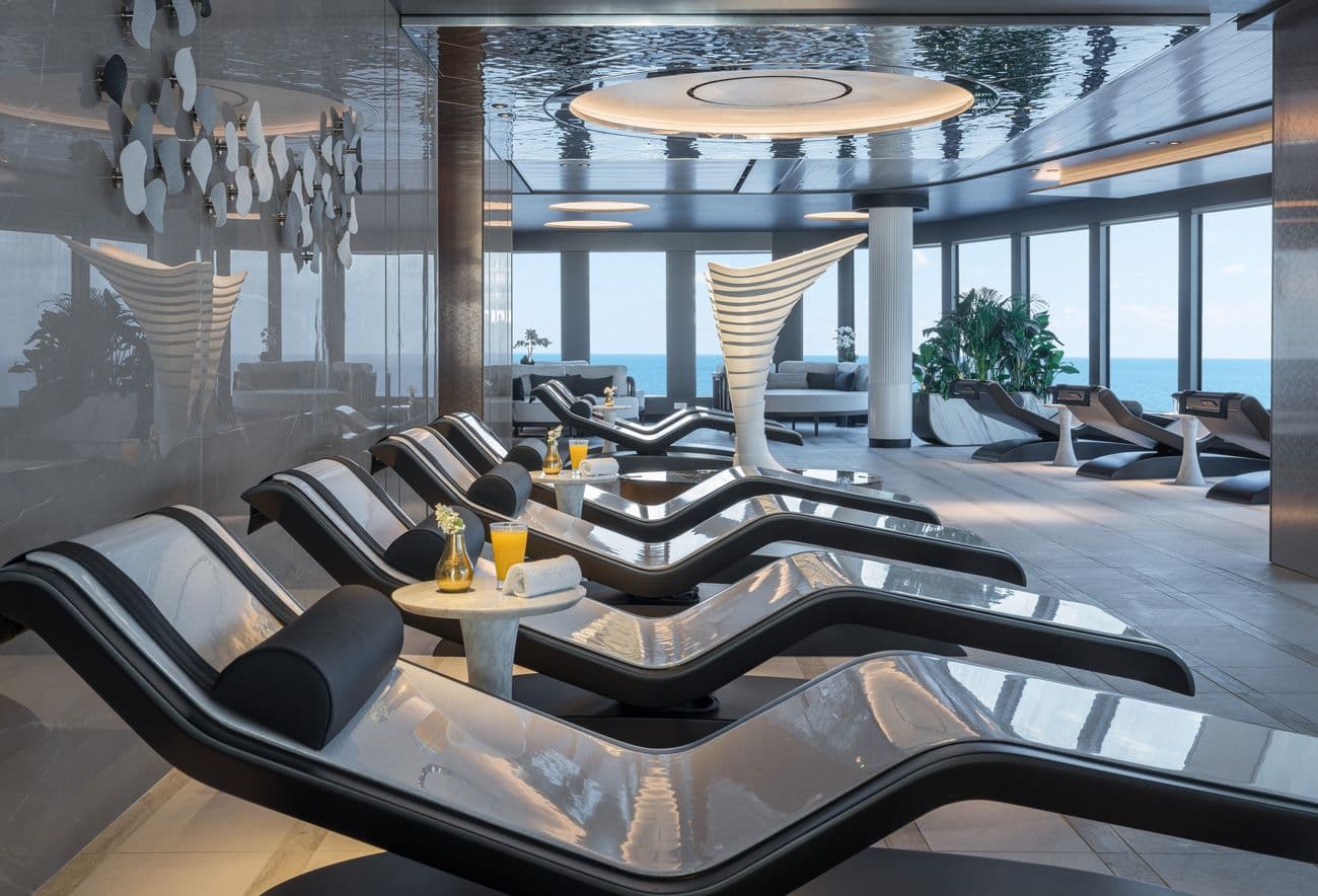 Norwegian Joy spa thermal suite relaxation lounge with heated loungers and ocean views