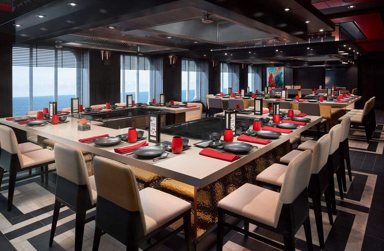 Teppanyaki restaurant with hibachi tables and ocean-facing windows
