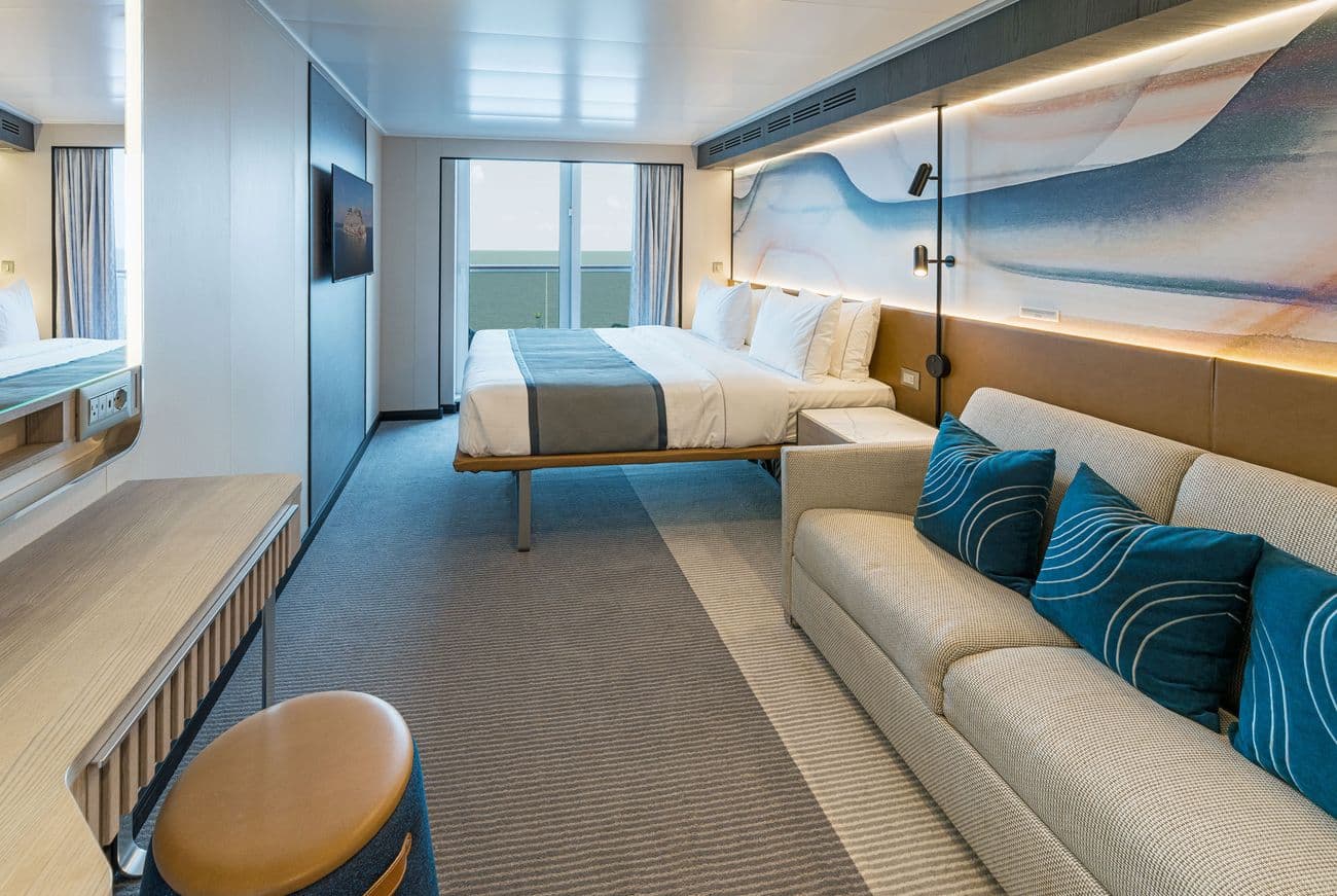 Balcony stateroom rendering with ocean-facing glass doors