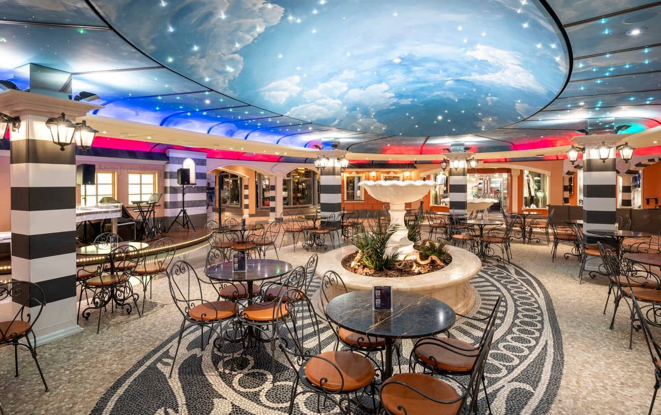 Piazza San Giorgio indoor promenade with café seating