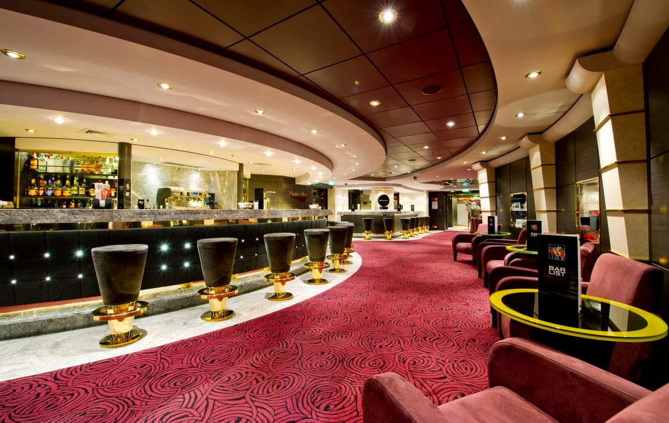 Modern cruise ship lounge with curved bar
