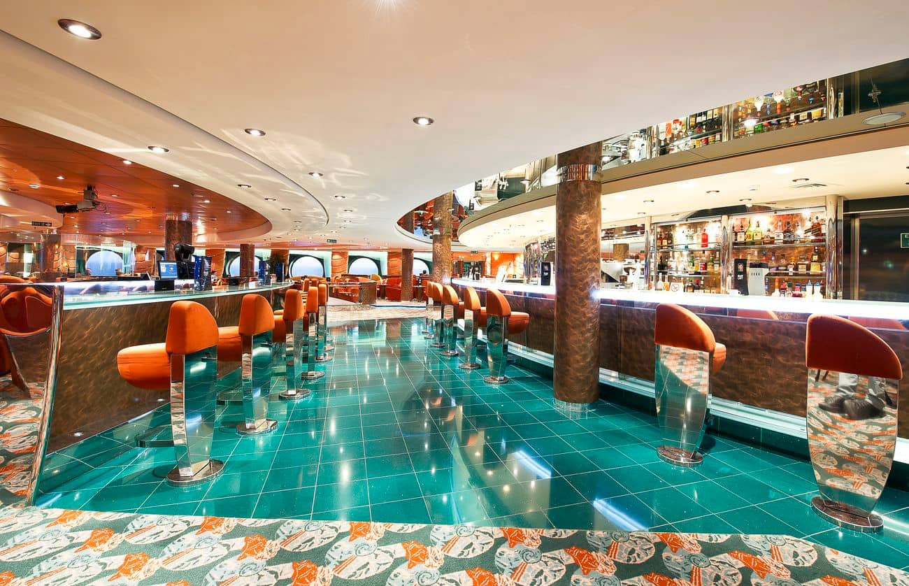 Crystal Lounge bar with curved counter and orange seating