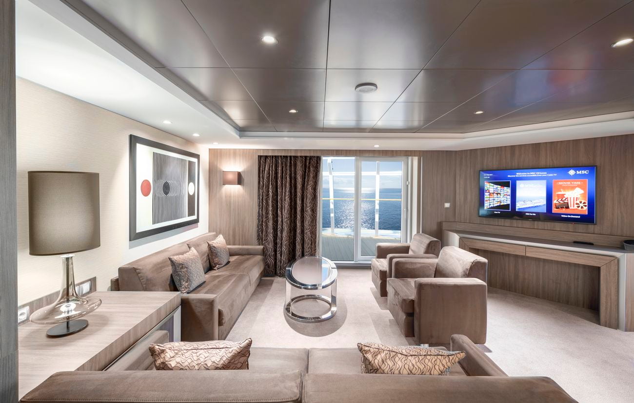 MSC Virtuosa Yacht Club Royal Suite living area with balcony