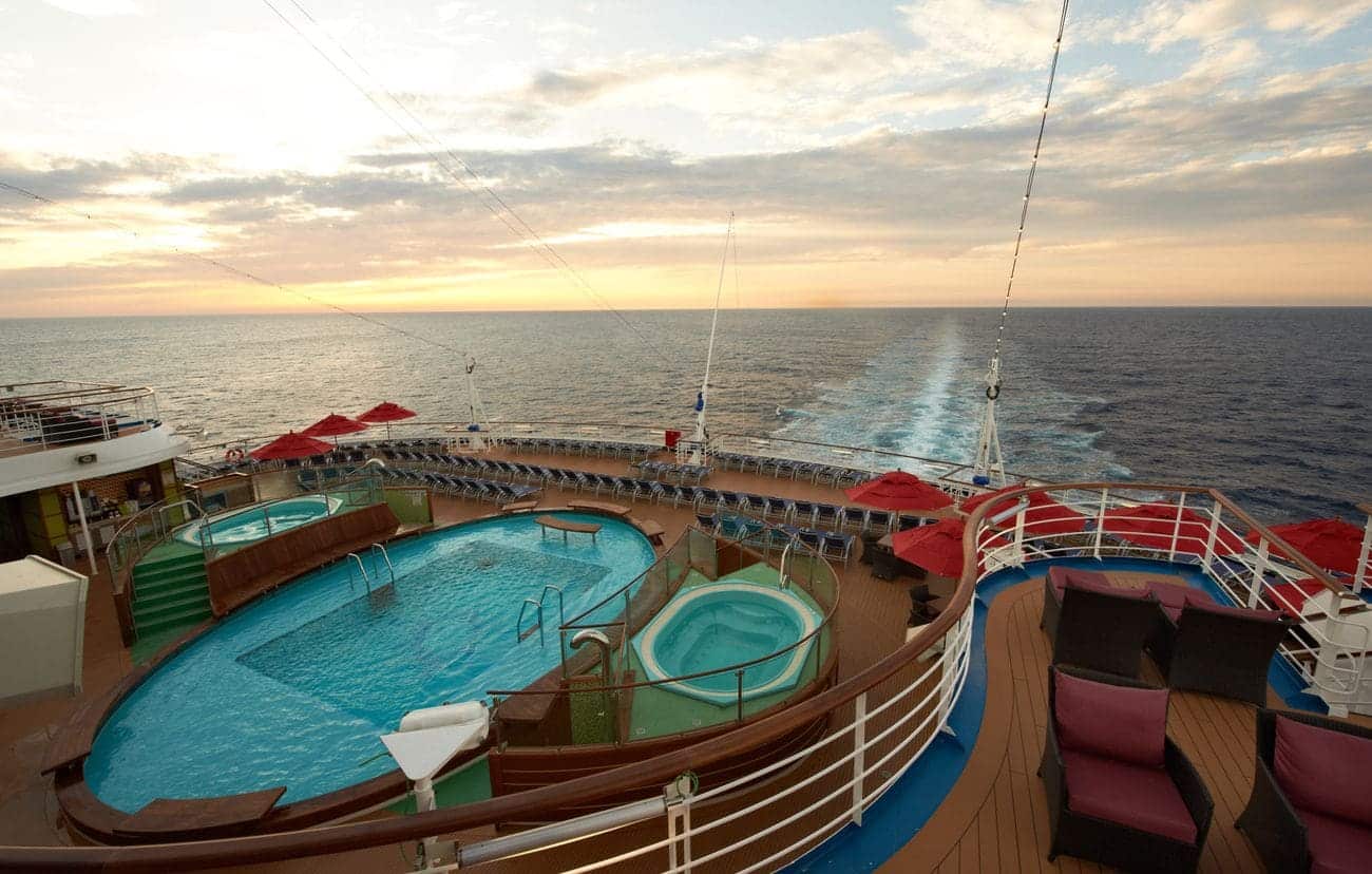 Aft pool and whirlpool area overlooking open ocean wake