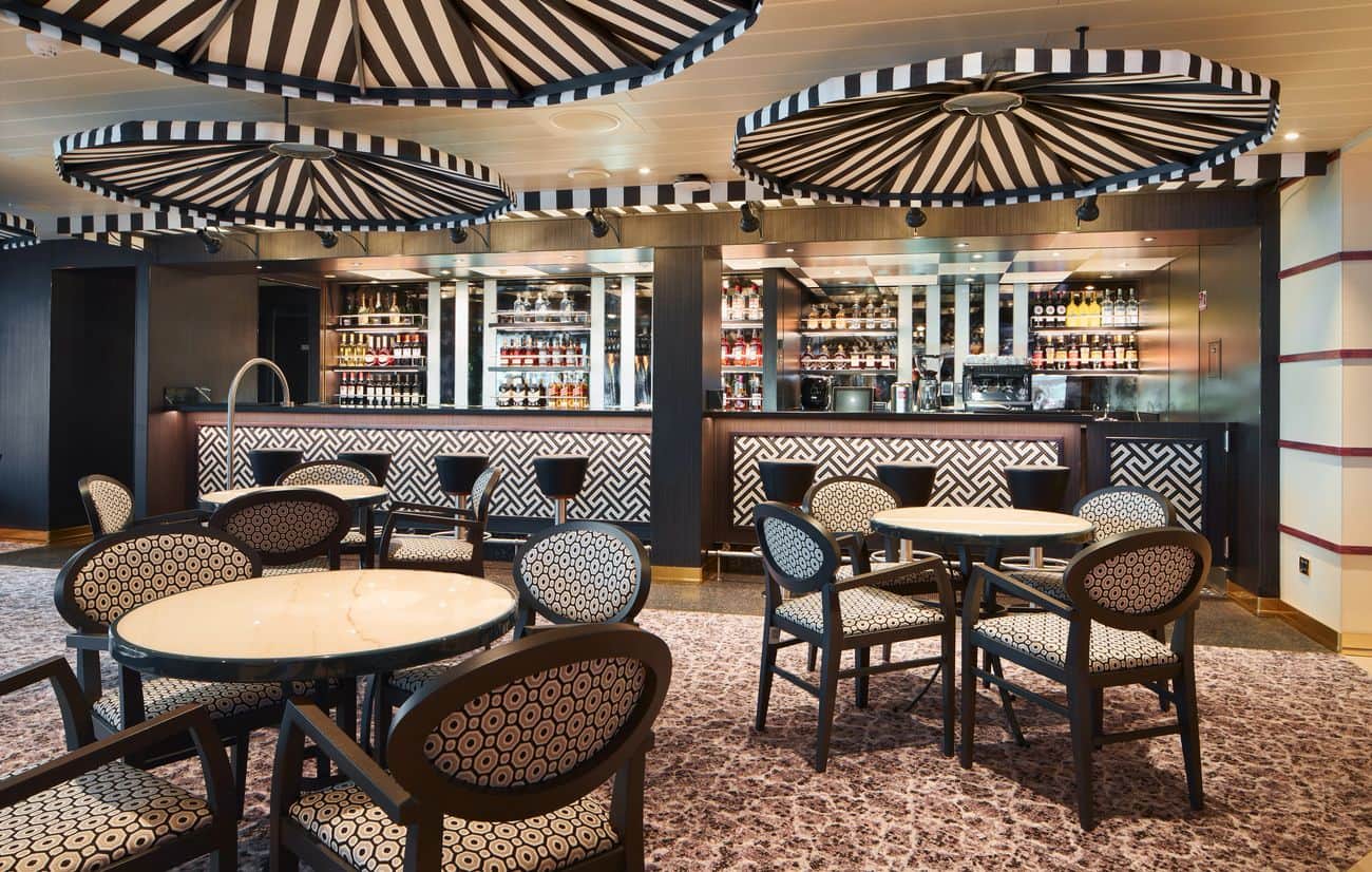 Carnival Firenze Tuscan Lounge bar area with striped canopy-style lighting design