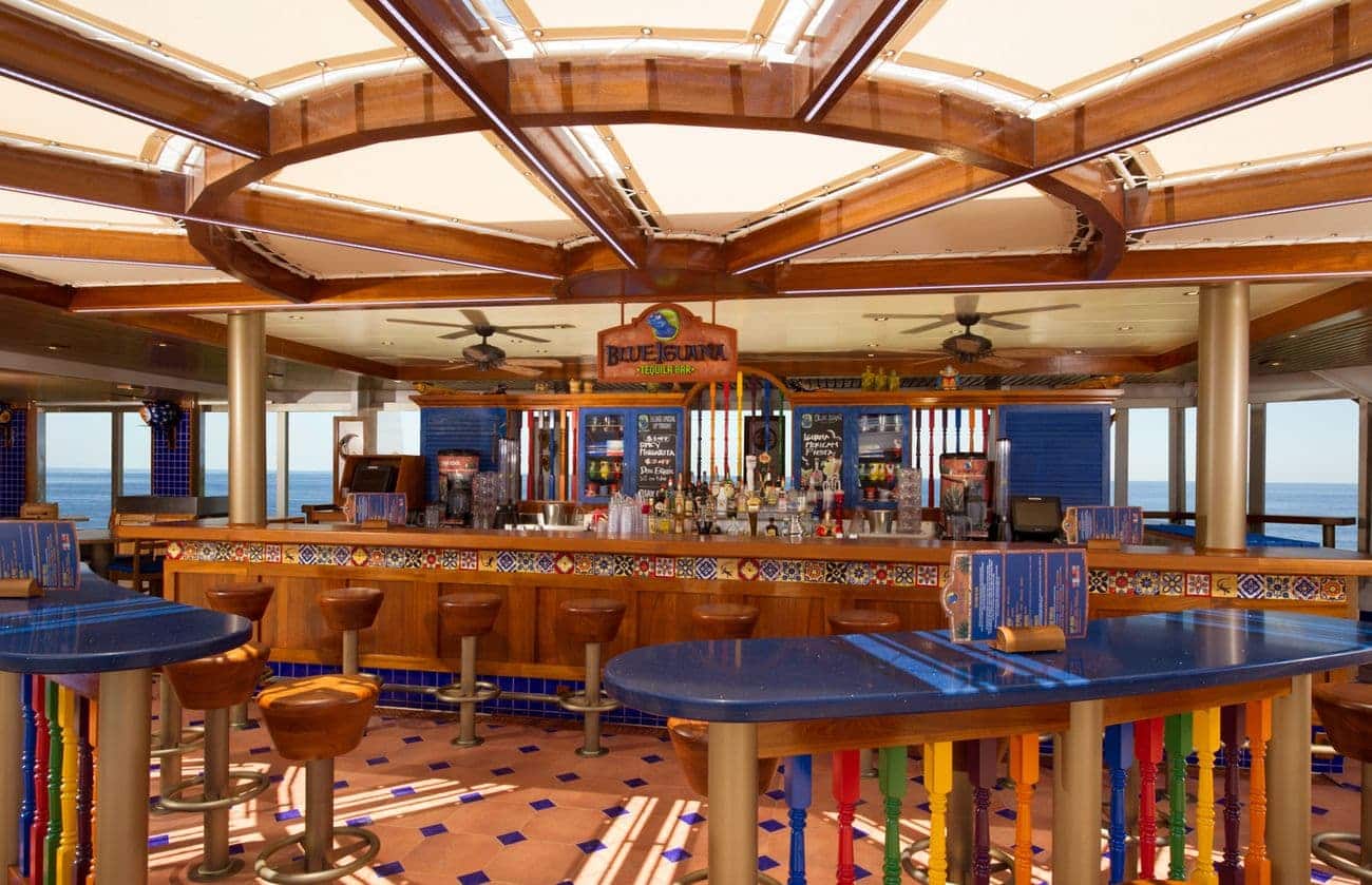 BlueIguana Tequila Bar aboard Carnival Freedom with colorful décor and open ocean views