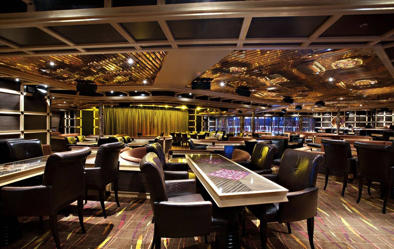 Ebony Cabaret Lounge entertainment venue aboard Carnival Glory with leather seating and small stage