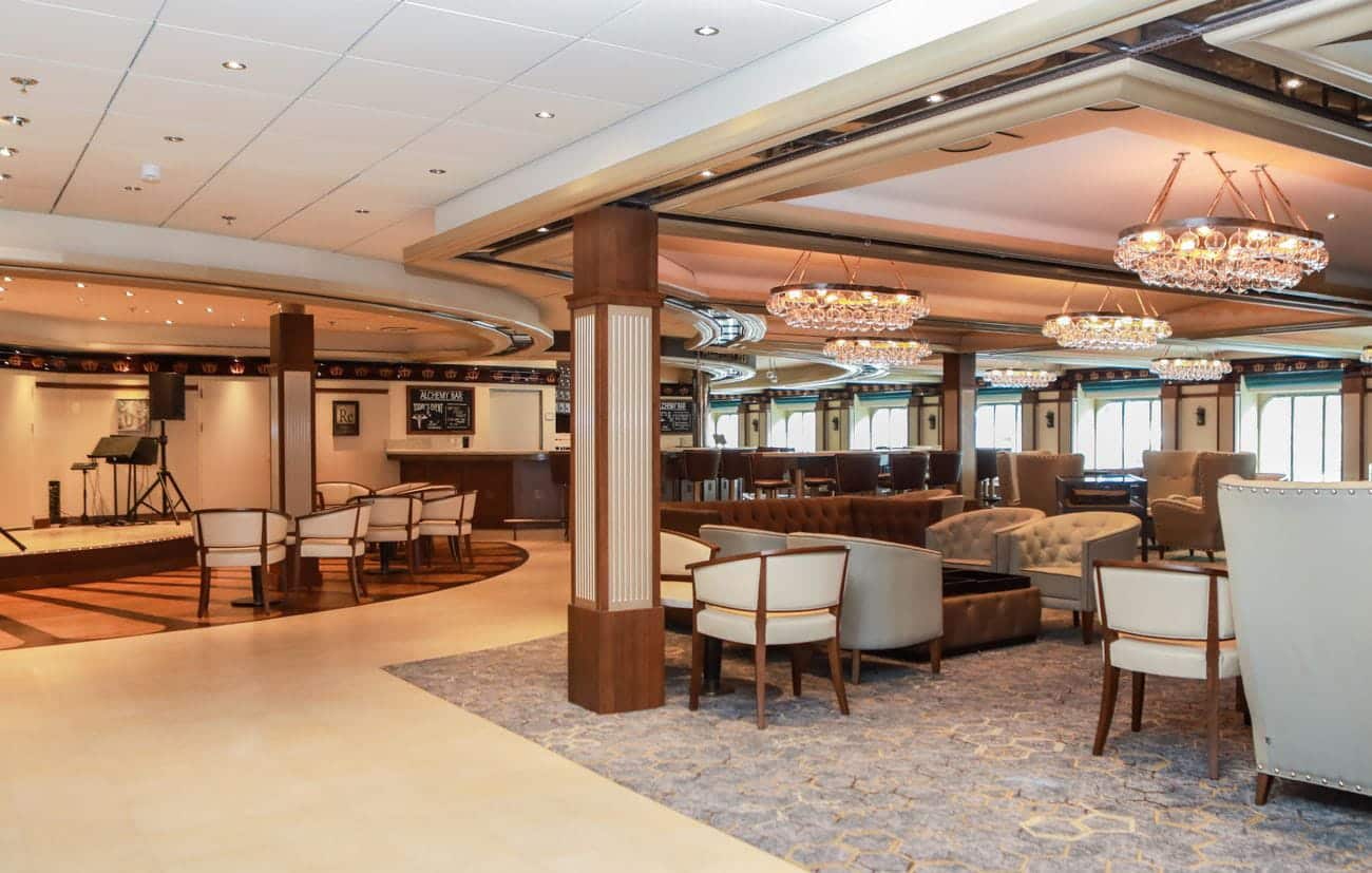 Alchemy Bar lounge seating area with chandeliers and live music space