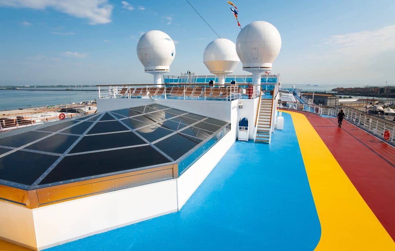 Carnival Luminosa jogging track with colorful deck and radar domes