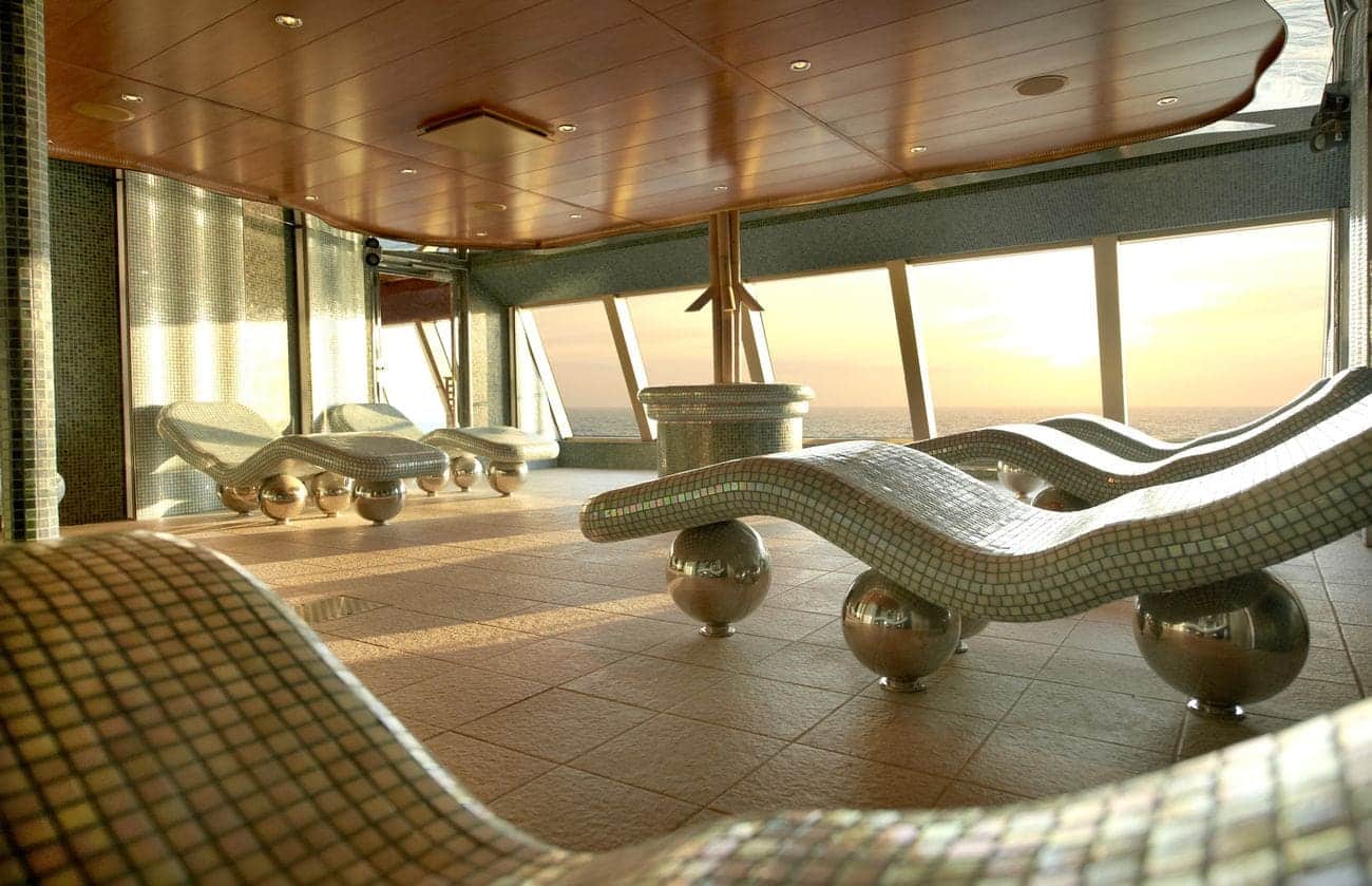 Thermal suite loungers inside Cloud 9 Spa with ocean views and mosaic tile relaxation chairs