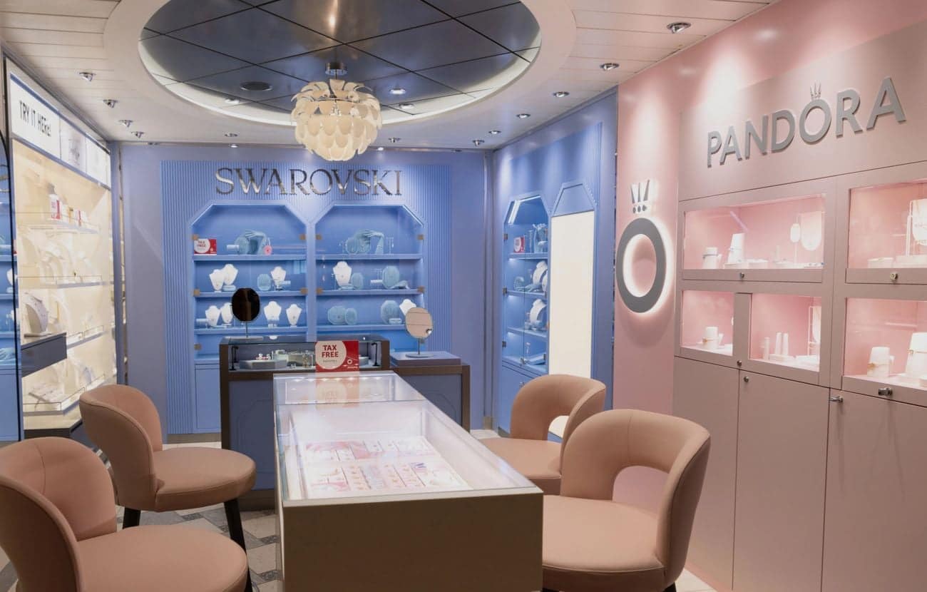 onboard duty free jewelry boutique with Swarovski and Pandora displays on modern cruise ship