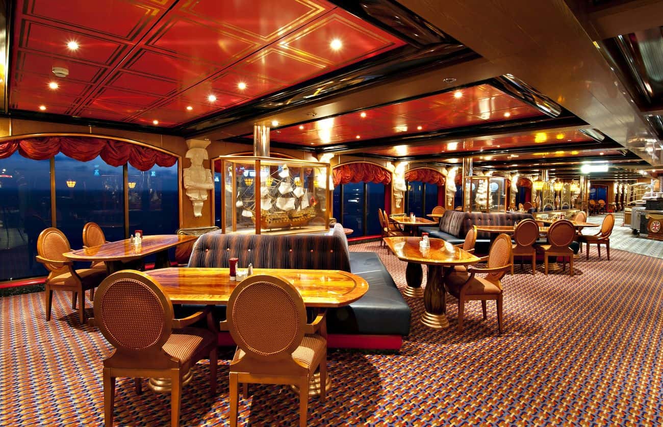 Lido restaurant dining area with ocean views tables and warm interior tones