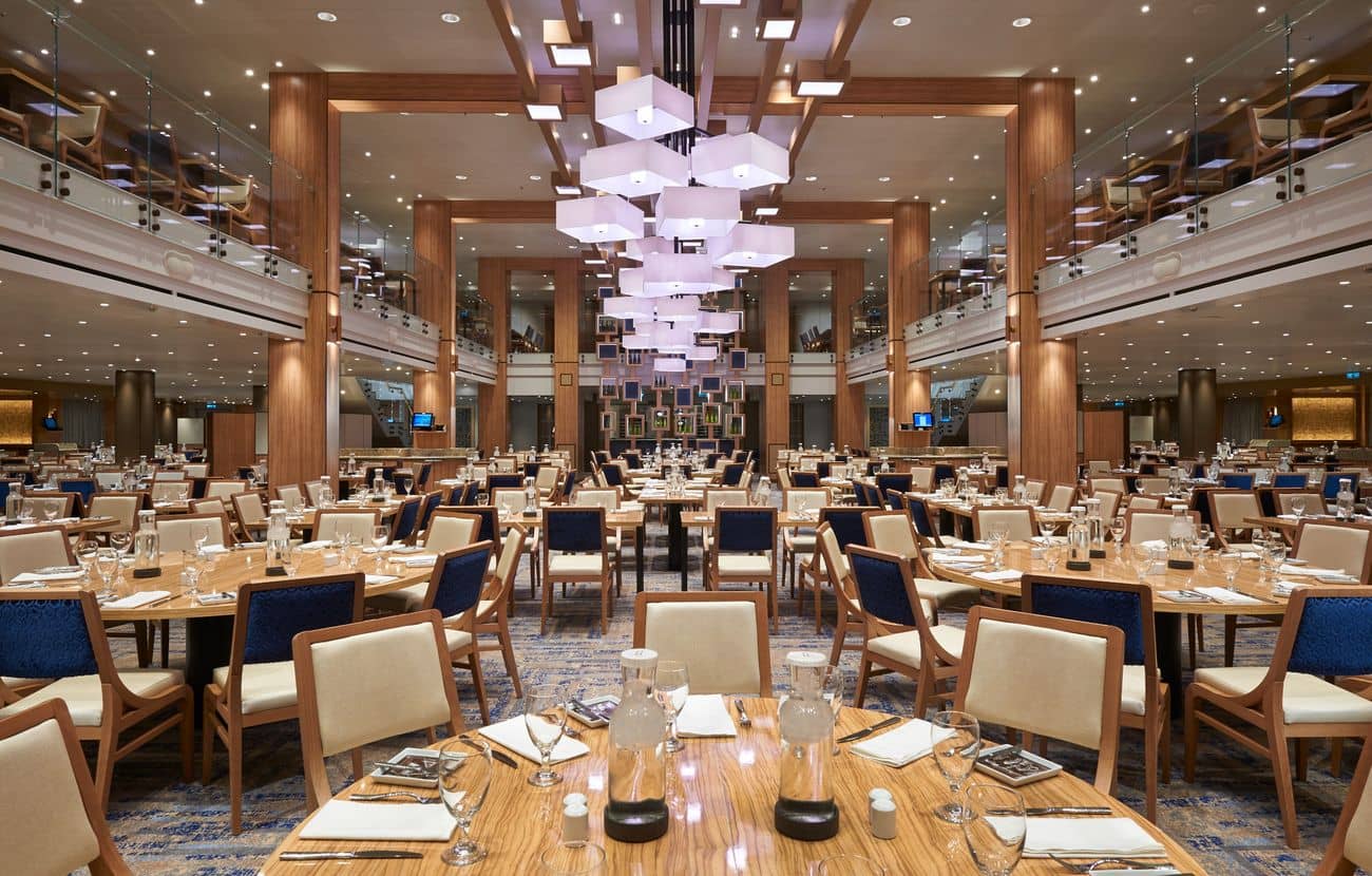 Vista Restaurant main dining room on Carnival Panorama with double-height ceiling and modern chandeliers