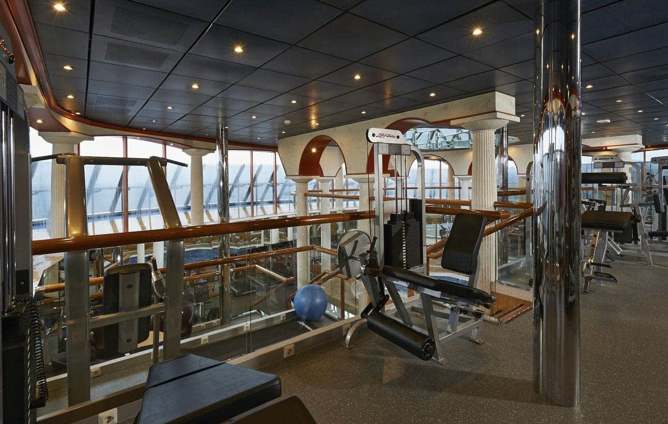 Glass-lined fitness center with cardio and strength equipment